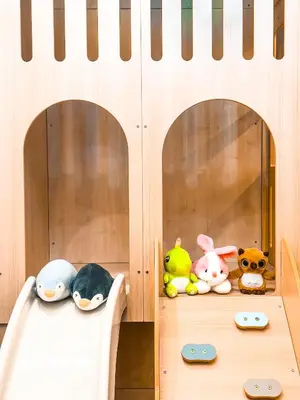 two shelves with stuffed animals in a play room at KidsCastle Dorsett Pavillion in Kuala Lumpur