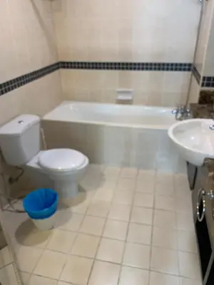 a bathroom with a toilet and a tub and a sink at seri bukit ceylon by sweet cozy house in Kuala Lumpur