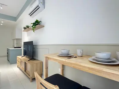 a living room with a table with dishes on it at The Majestic Residence By Awesomestay in Kuala Lumpur