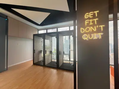 an office with glass doors with a sign that says get fit dont quit at The Majestic Residence By Awesomestay in Kuala Lumpur