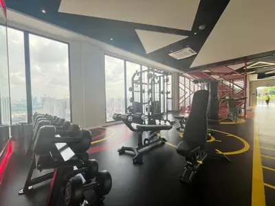 a gym with treadmills and cardio equipment in a building at The Majestic Residence By Awesomestay in Kuala Lumpur