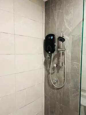 a shower in a bathroom with a shower at Majestic Infinity Pool by KLCC in Kuala Lumpur