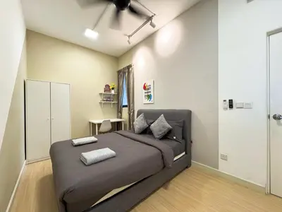 a bedroom with a bed and a desk in it at 4BR KLCC View MRT 2min Free Parking Big Unit in Kuala Lumpur