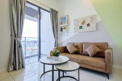a living room with a couch and a table at KL City Central TRX 3 Bedrooms 2 Baths & Balcony in Kuala Lumpur
