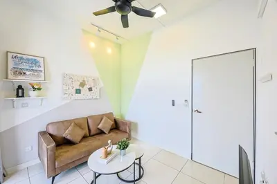 a living room with a couch and a table at KL City Central TRX 3 Bedrooms 2 Baths & Balcony in Kuala Lumpur