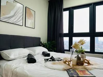 a bedroom with a white bed with a large window at MVA19#Family Suite 8 pax 3 Rooms Sunway Velocity Mall, MRT Maluri Cheras in Kuala Lumpur