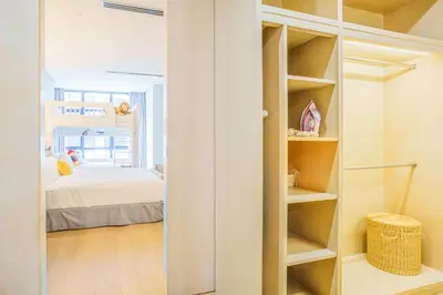 a room with a closet with a bed at 188 Suites by KidsCastle in Kuala Lumpur