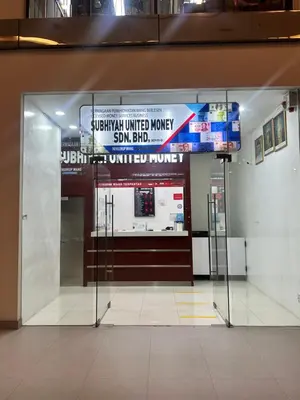 a glass door in a building with a united worker sign at Cozy Family Suite 5pax KLCC by SS HOME in Kuala Lumpur