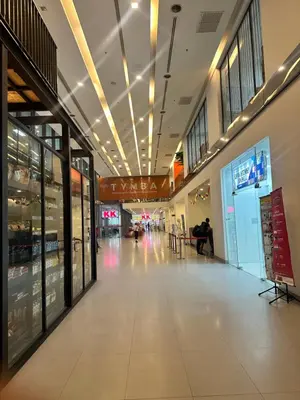 a shopping mall with a hallway with a lot of windows at Cozy Family Suite 5pax KLCC by SS HOME in Kuala Lumpur