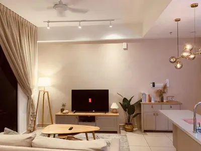 a living room with a couch and a tv at Comfy 1BR klcc view imperial suite B47 09 Trion KL in Kuala Lumpur
