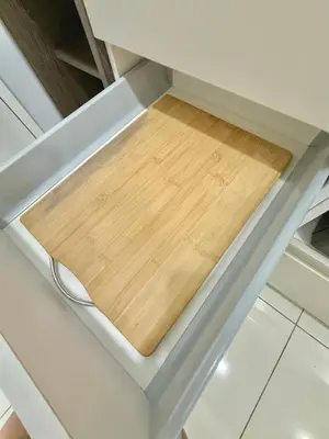 a wooden cutting board on top of a kitchen counter at Robertson Homefeel 1R1B at Bukit Bintang KL KLCC in Kuala Lumpur