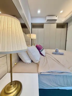 a bedroom with a bed with a lamp next to it at Robertson Homefeel 1R1B at Bukit Bintang KL KLCC in Kuala Lumpur