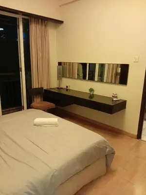 a bedroom with a large bed and a mirror at Seri bukit Ceylon by anhome changkat in Kuala Lumpur