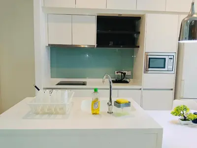 a kitchen counter top with a sink and a sink at The Platinum Suite KL in Kuala Lumpur