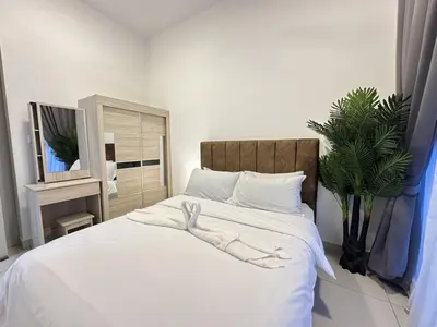a bedroom with a bed with white towels on it at Couple 1BR cozy suite B41 05 Trion KL in Kuala Lumpur