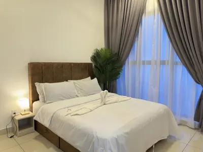 a bedroom with a large bed with a large window at Couple 1BR cozy suite B41 05 Trion KL in Kuala Lumpur