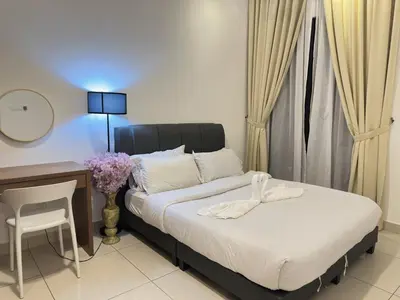 a bedroom with a bed and a desk and a table and chair at Couple 1BR suite B33 03 free parking Netflix Trion KL in Kuala Lumpur