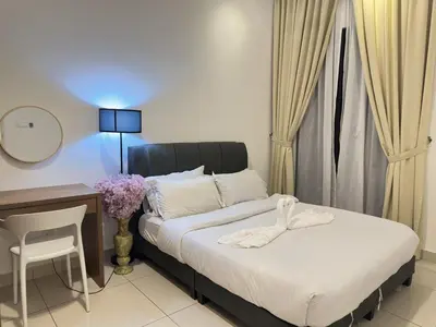 a bedroom with a bed and a desk and a table and chair at Couple 1BR suite B33 03 free parking Netflix Trion KL in Kuala Lumpur