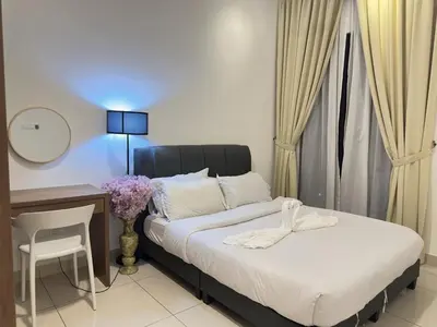 a bedroom with a bed and a desk and a table and chair at Couple 1BR suite B33 03 free parking Netflix Trion KL in Kuala Lumpur