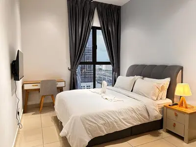 a bedroom with a large bed and a window at Couple Studio Suite A16 07 Trion KL in Kuala Lumpur