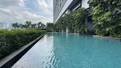 a swimming pool in the middle of a building at Couple Studio Suite A16 07 Trion KL in Kuala Lumpur