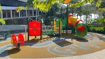 a playground with colorful playground equipment in a park at Couple Studio Suite B29 03A Trion KL in Kuala Lumpur