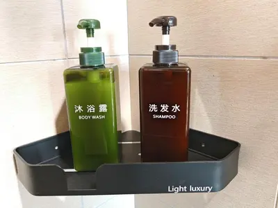 two bottles of soap in a black container at O 3 Room 200mbps wifi near Mrt Lrt HKL PWTC KLCC in Kuala Lumpur