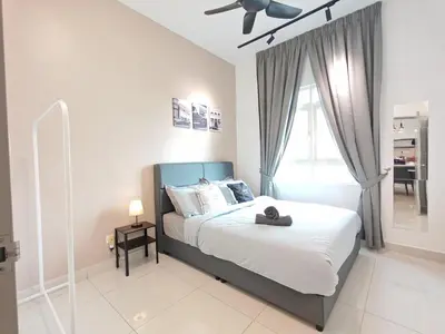 a bedroom with a bed with a hat on it at O 3 Room 200mbps wifi near Mrt Lrt HKL PWTC KLCC in Kuala Lumpur