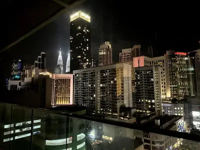 a view of a city skyline at night at Bintang Fairlane Residence, KLCC & City View with Bathtub - 2B1R in Kuala Lumpur