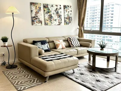 a living room with a couch and a table at Bintang Fairlane Residence, KLCC & City View with Bathtub - 2B1R in Kuala Lumpur