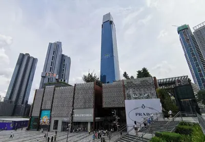 a group of people walking in a city with a tall building at Bintang Fairlane Residence, KLCC & City View with Bathtub - 2B1R in Kuala Lumpur