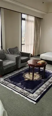 a living room with a couch and a coffee table at Times Apartment at Times Square in Kuala Lumpur
