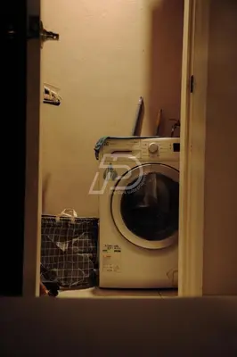 a bathroom with a washing machine in a room at Dorsett Hartamas KL, Bathtub Smart TV & WiFi in Kuala Lumpur