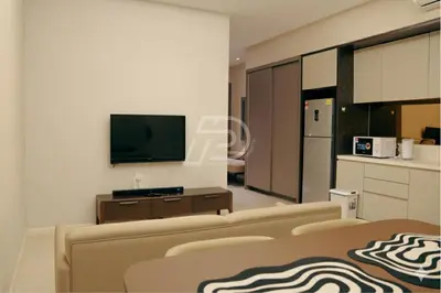 a living room with a couch and a tv at Dorsett Hartamas KL, Bathtub Smart TV & WiFi in Kuala Lumpur