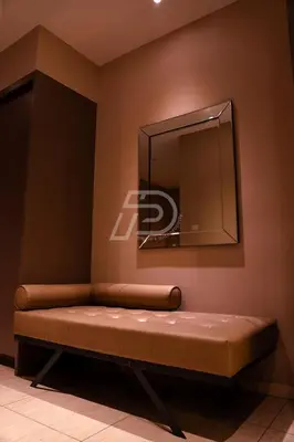 a bench in a room with a mirror at Dorsett Hartamas KL, Bathtub Smart TV & WiFi in Kuala Lumpur