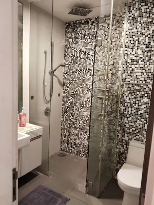 a bathroom with a glass shower with a toilet at Condo in Jalan Ampang- near KLCC IJN Gleneagles HKL TRX in Kuala Lumpur