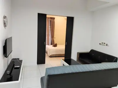 a living room with a couch and a mirror at Condo in Jalan Ampang- near KLCC IJN Gleneagles HKL TRX in Kuala Lumpur