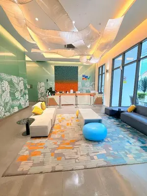 a living room with a couch and a table at The Sentral Nook KL Sentral By Riveria city in Kuala Lumpur