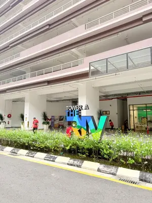 a building with a sign that reads forever a lift at The Sentral Nook KL Sentral By Riveria city in Kuala Lumpur