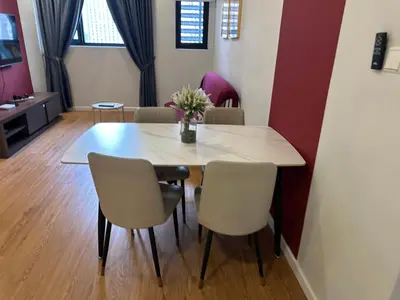 a dining room with a table and chairs at Chamber Haven KL in Kuala Lumpur