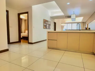a large kitchen with a counter in a room at Suasana Suites by Lisa in Kuala Lumpur