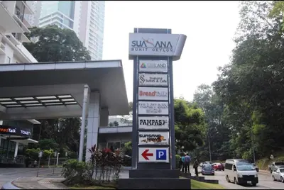 a street sign in front of a gas station at Suasana Suites by Lisa in Kuala Lumpur