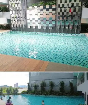 two pictures of a swimming pool in a building at Neu Suites in Kuala Lumpur
