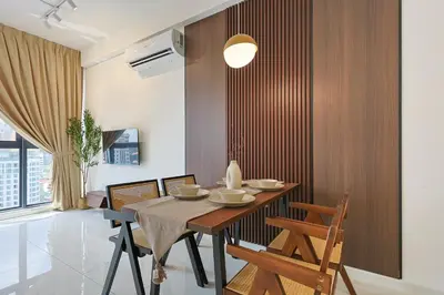 a dining room with a table and some chairs at Majestic Residence Home Plus in Kuala Lumpur
