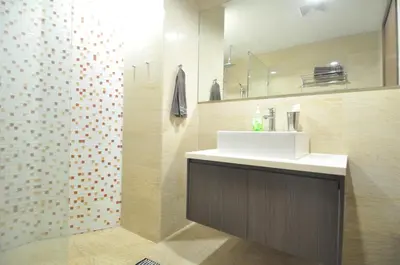 a bathroom with a sink and a shower at Amazing KLCC View @ Regalia Residence in Kuala Lumpur
