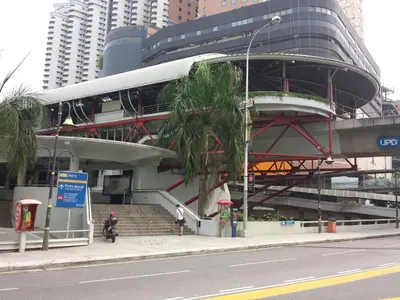a building with a bus parked in front of it at Amazing KLCC View @ Regalia Residence in Kuala Lumpur