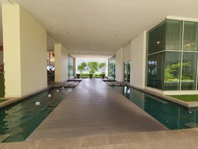 an indoor pool in a building with a house at Amazing KLCC View @ Regalia Residence in Kuala Lumpur