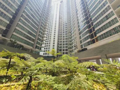 a group of tall buildings with trees in front of them at Amazing KLCC View @ Regalia Residence in Kuala Lumpur