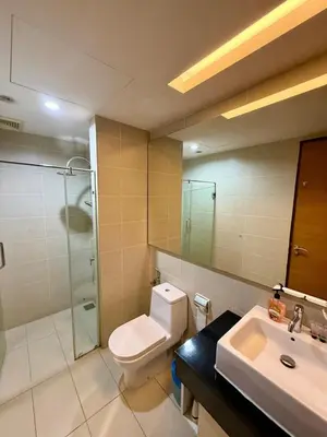 a bathroom with a toilet and a sink and a shower at 0710 Sweet Home-Casa Residency 2R 2B in Kuala Lumpur
