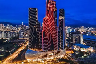 a large building is lit up at night at Stylish 2 bedroom duplex bedroom city center in Kuala Lumpur